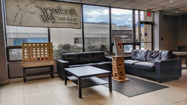 Lounge with couches and large mini-games for parents and guests to hang out