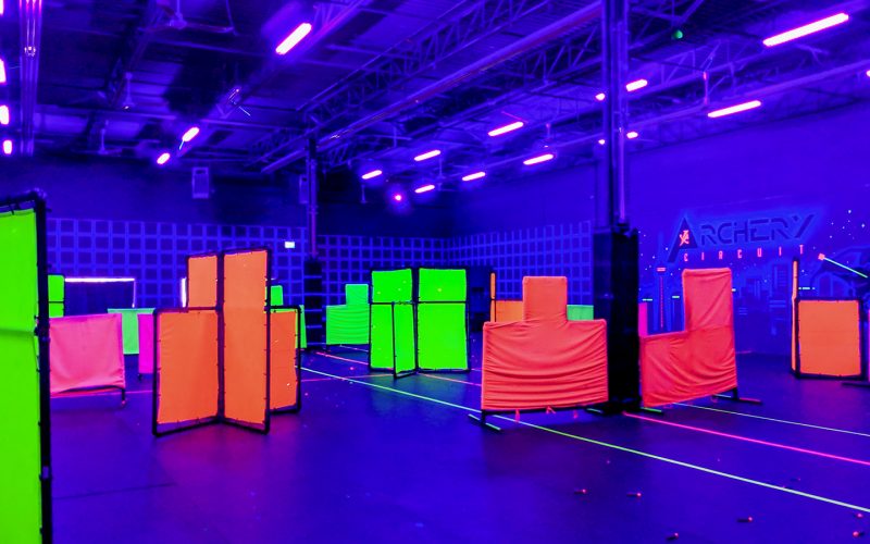 Archery Circuit arena, inside, blacklights on