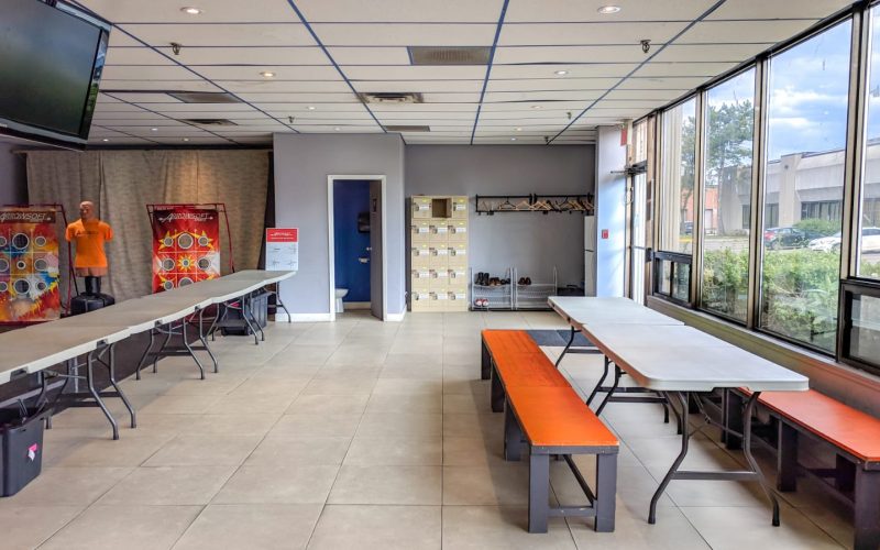 View of lounge, including main eating area and tables for food/goody bags/setting up